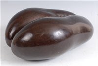 Lot 1256 - A coco de mer, polished and with hair, 34cm