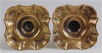 Lot 1257 - A pair of mid-18th century brass taper sticks,...