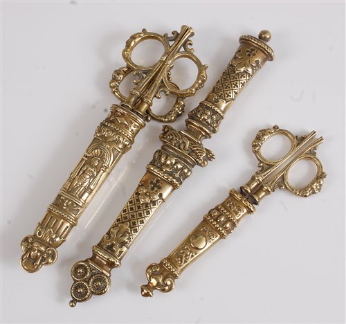 Lot 1288 - Two pairs of Victorian brass desk scissors,...