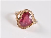 Lot 1185 - A 14k heart shaped ruby and diamond ring, the...
