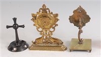 Lot 1296 - A Victorian cast brass watch holder, the back...