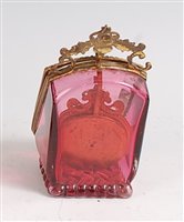 Lot 1297 - A circa 1900 cranberry glass watch holder,...