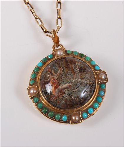 Lot 2656 - A reverse painted intaglio pendant and chain,...