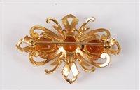 Lot 2595 - A 9ct citrine brooch, the three oval citrines,...