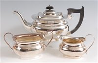 Lot 1125 - A Georgian style silver three-piece tea set,...