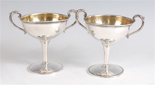 Lot 1127 - A pair of American sterling silver pedestal...