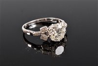 Lot 1199 - A diamond ring, the principal round brilliant...