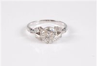 Lot 1199 - A diamond ring, the principal round brilliant...
