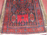 Lot 1556 - A Persian woollen Kurdish rug, the blue ground...