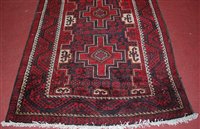 Lot 1561 - A Persian woollen rug, the blue ground...