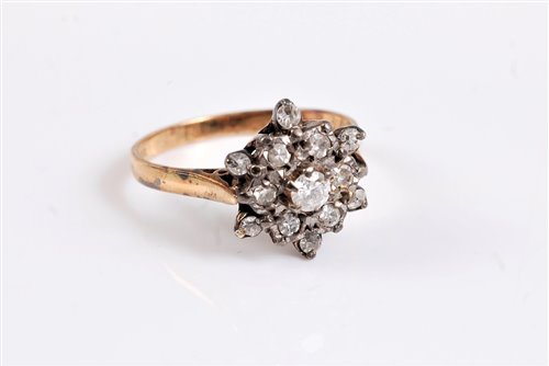 Lot 2607 - A 9ct diamond cluster ring, the central round...
