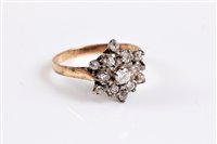 Lot 356 - A 9ct diamond cluster ring, the central round...