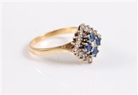 Lot 348 - An 18ct sapphire and diamond cluster ring, the...