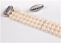 Lot 2512 - A 14ct white gold sapphire and cultured pearl...