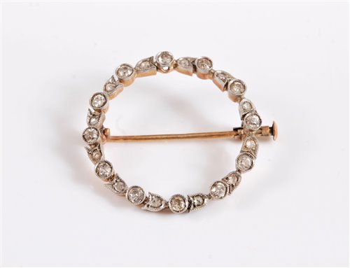 Lot 2593 - A diamond wreath brooch, the wreath set with...