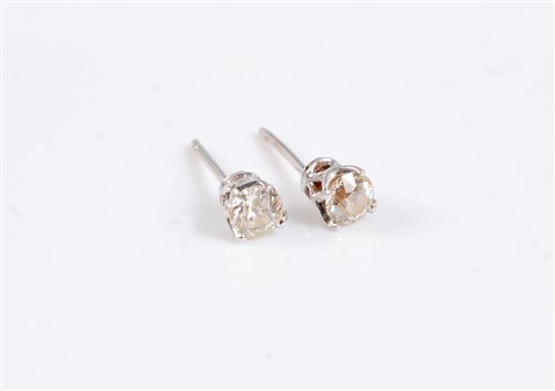 Lot 2678 - A pair of diamond earstuds, the round...