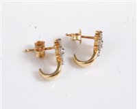 Lot 2547 - A pair of 18k diamond earrings, the diamond...