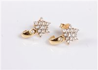 Lot 2547 - A pair of 18k diamond earrings, the diamond...