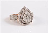Lot 2608 - A 9ct diamond cluster ring, the pear shaped...