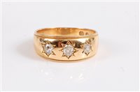 Lot 2550 - An 18ct three stone diamond ring, the three...