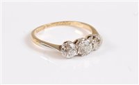 Lot 2636 - An 18ct and platinum three stone diamond ring,...