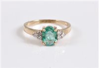 Lot 2650 - A 9ct emerald and diamond ring, the oval pale...