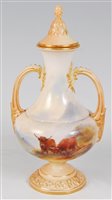 Lot 1037 - *A Royal Worcester porcelain twin handled vase...