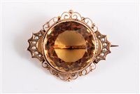 Lot 2596 - A 9ct citrine and seed pearl brooch, the round...