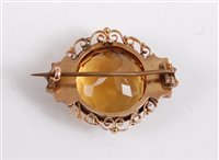 Lot 2596 - A 9ct citrine and seed pearl brooch, the round...