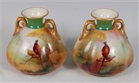 Lot 1040 - *A pair of Royal Worcester twin handled...