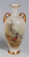 Lot 1042 - *A Royal Worcester porcelain twin handled vase,...