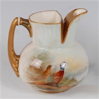 Lot 1043 - *A Royal Worcester porcelain jug, of squat...