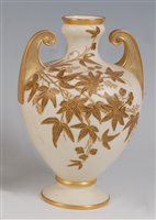 Lot 1055 - *A Royal Worcester porcelain twin handled vase,...