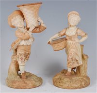 Lot 1058 - *A pair of Royal Worcester blush ivory figures,...
