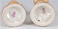 Lot 1058 - *A pair of Royal Worcester blush ivory figures,...