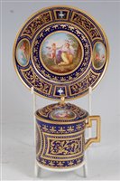 Lot 1074 - *A 19th century Vienna porcelain chocolate cup...