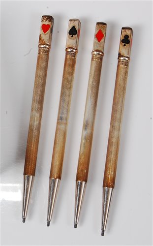Lot 110 - Four 1930s sterling silver propelling pencils,...