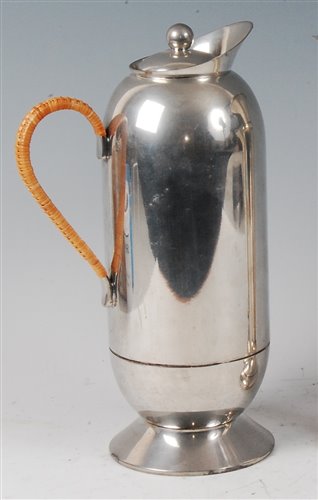 Lot 103 - *Nick Monroe - a contemporary pewter water jug...