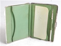 Lot 1113 - *An Edwardian silver pocket notebook case, of...