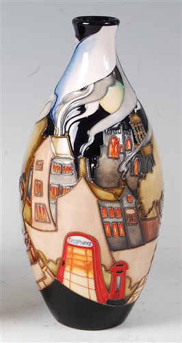 Lot 2 - A Moorcroft pottery vase in the Village...