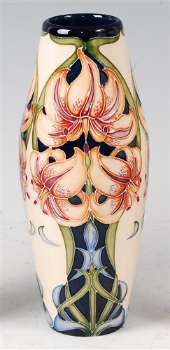 Lot 4 - A Moorcroft pottery vase in the Lily pattern...