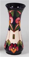 Lot 11 - A small Moorcroft pottery vase in the Trilogy...