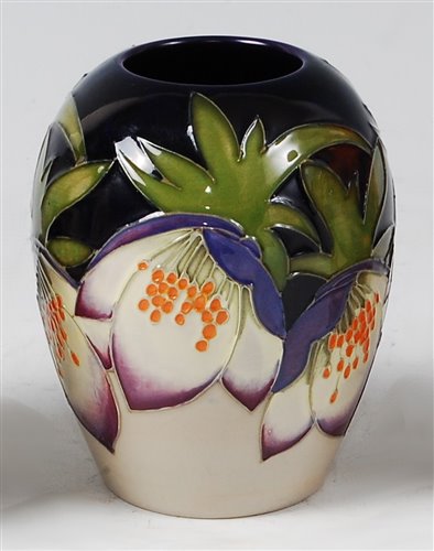 Lot 13 - A small Moorcroft pottery vase in the Purple...