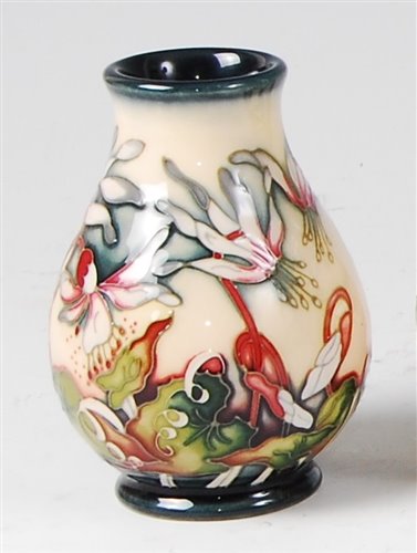 Lot 15 - A small Moorcroft pottery vase in the Minuet...
