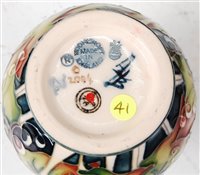 Lot 15 - A small Moorcroft pottery vase in the Minuet...