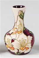 Lot 17 - A small Moorcroft pottery vase in the Gladioli...