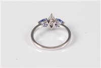Lot 2638 - A 14ct tanzanite and diamond ring, the central...