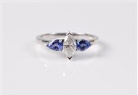 Lot 2638 - A 14ct tanzanite and diamond ring, the central...