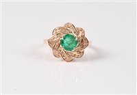 Lot 2651 - A 9ct emerald and diamond ring, the round...