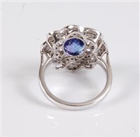 Lot 1169 - A 14ct tanzanite and diamond ring, the oval...